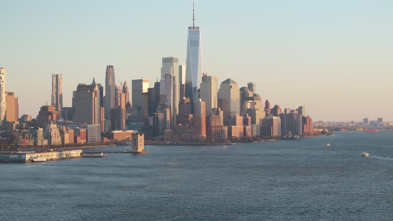 Aerial view of The World Trade Center at dusk. Shot along The Hudson River in New Jersey.