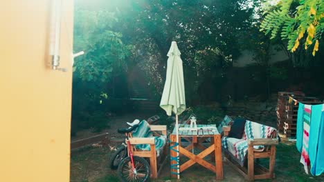 Beautiful-Establishing-Shot-of-Courtyard-Table-with-Umbrella-and-Chairs,-Budapest