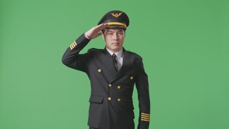 pilot saluting in uniform