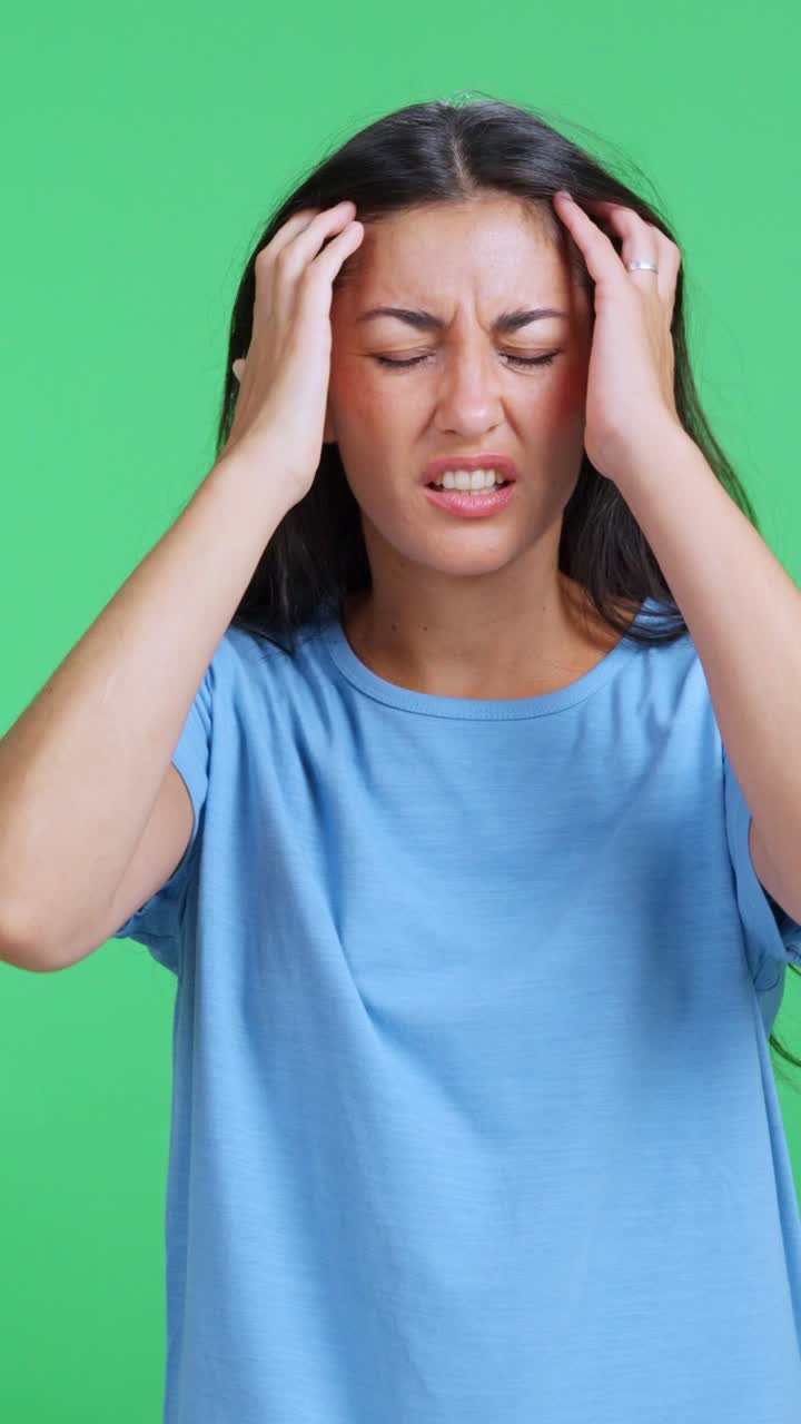 Stressed woman suffering from a severe headache
