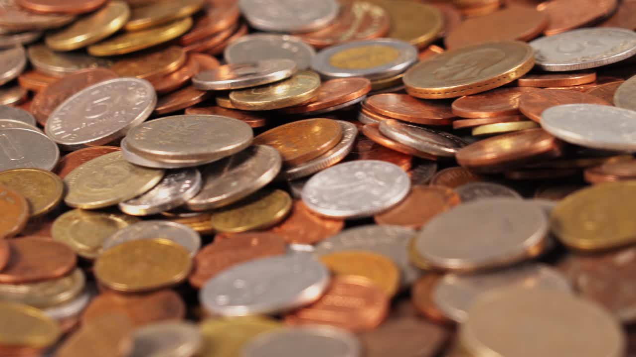 Coins collected in a close-up view showing different shapes and sizes