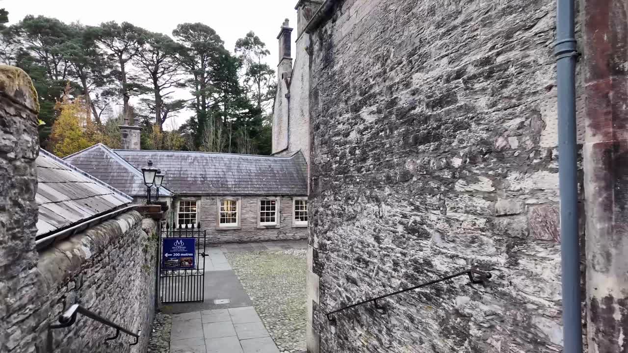 Muckross House architecture service courtyard covered with stone and stone buildings, Killarney national park, Ireland