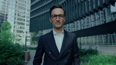 Portrait-Of-Elegant-Handsome-Caucasian-Man-Outdoors-In-Suit,-Looking-at-Camera-Arms-Crossed