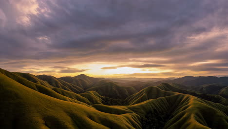 sunset over rolling hills