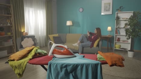 woman ironing clothes at home