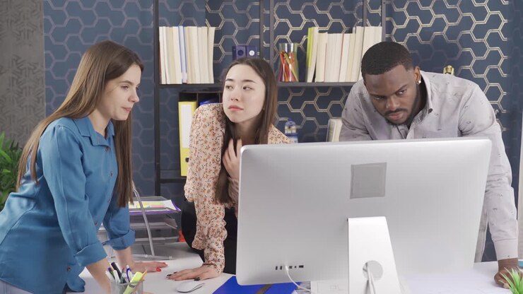Office workers of different races work together in the office.