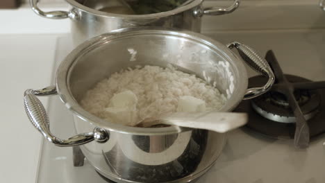 Chef-mixes-risotto-Italian-recipe