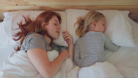 bed, sleeping and a mother with her daughter