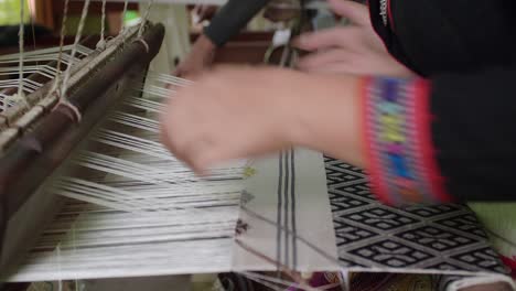 woman weaving on a loom