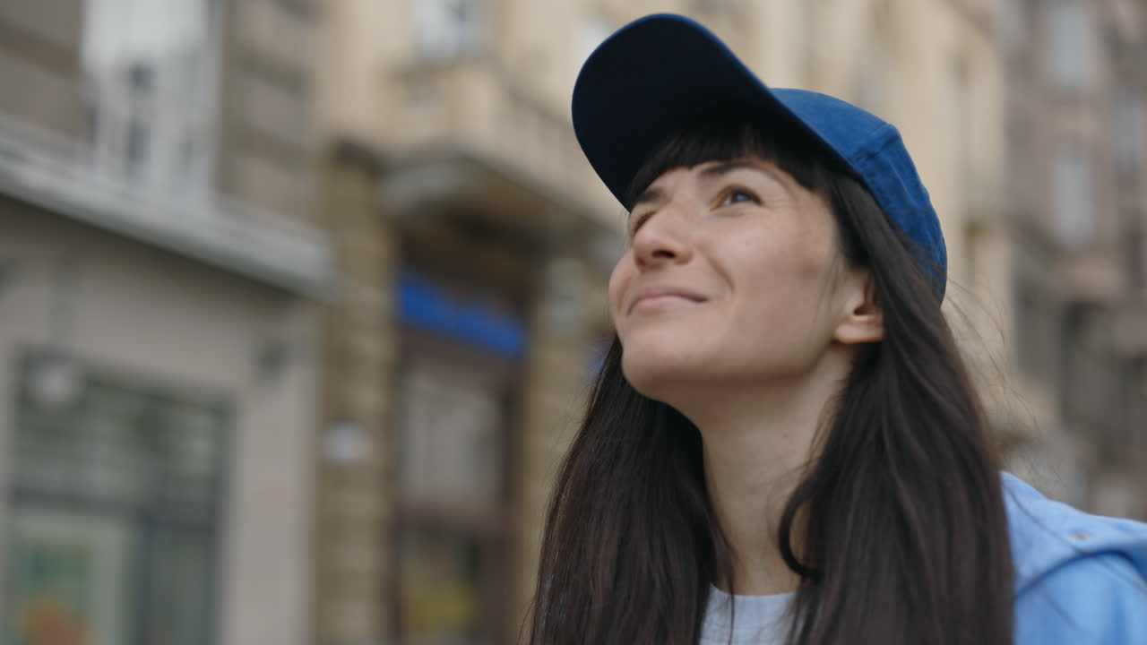 Portrait of a Young Woman Wearing a Blue Cap Outdoors