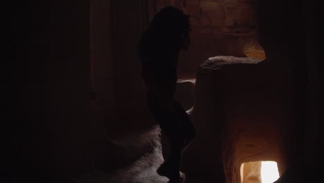 a woman is climbing down the stairs inside the cave houses in cappadocia, turkey