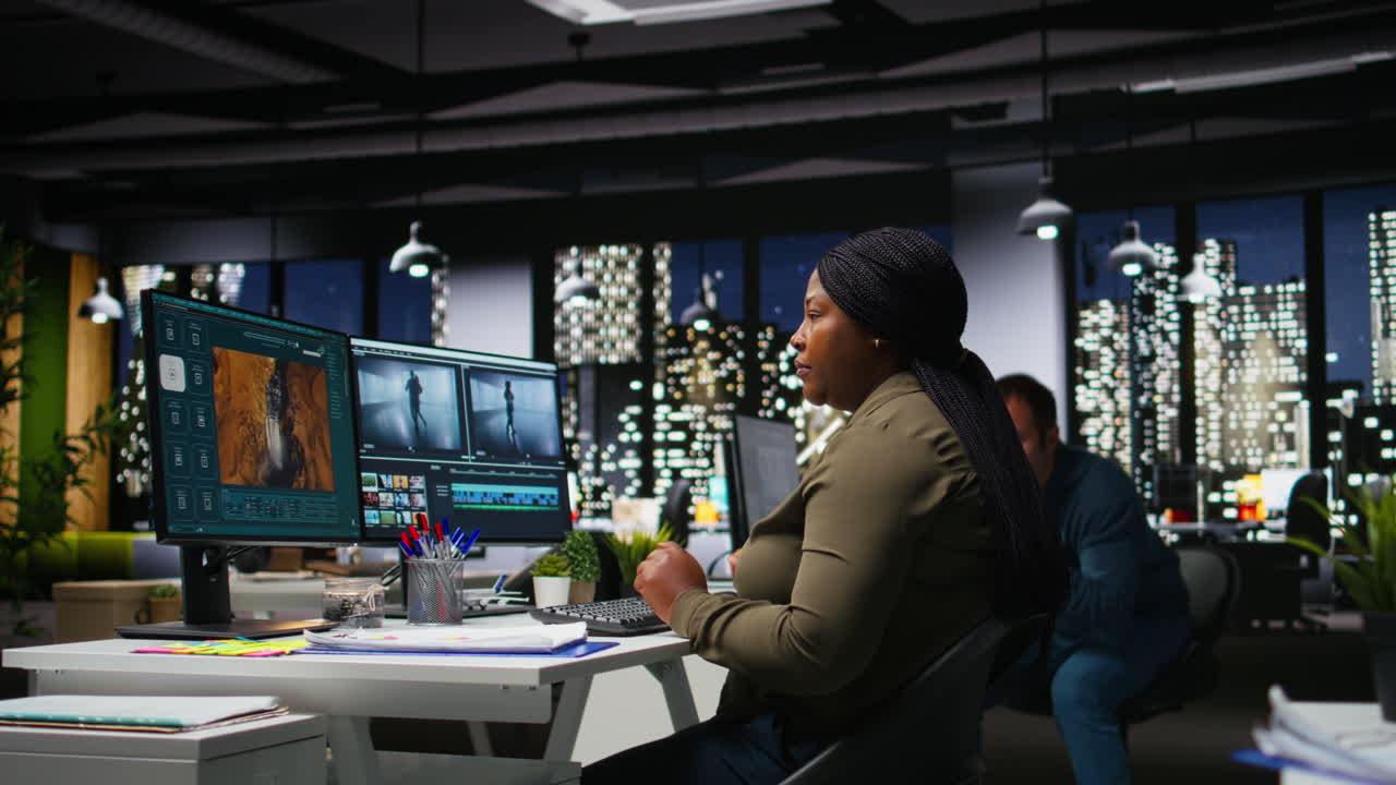 Diverse colleagues working together on video editing for a montage on software