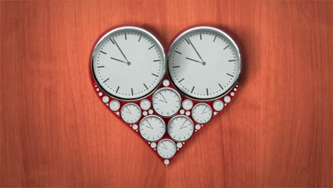 heart-shaped clocks in timelapse on wooden background