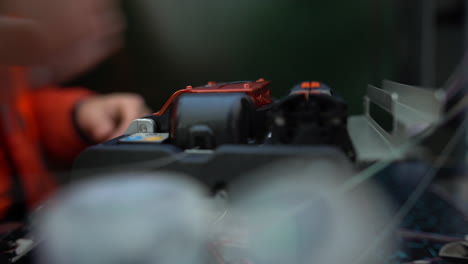 A-close-up-shot-of-a-worker-connecting-for-Cable-Internet-signal-and-Wire-connection-with-Fiber-Optic-Fusion-Splicing-machine