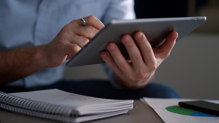Businessman hands using tablet