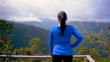 Forward-from-behind-of-a-charming-woman-in-blue-sweater