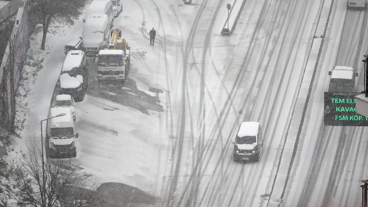 Snowy City Street with Vehicles