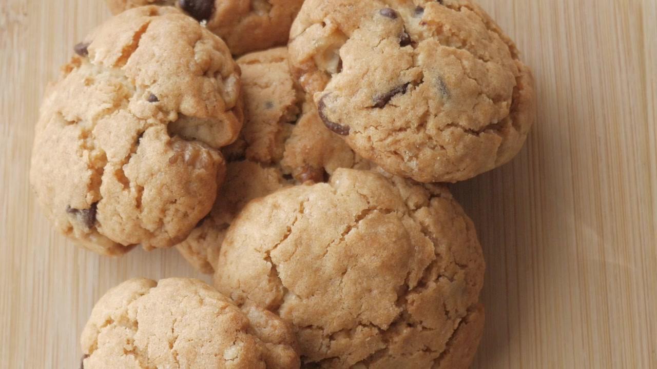 Close up shot of cookies on wooden background.