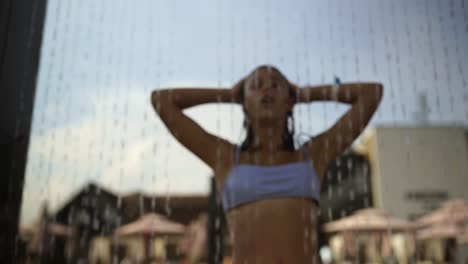 woman enjoying a refreshing outdoor shower