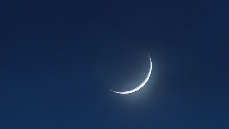 BRIGHT CRESCENT SILVER MOON AT NIGHT