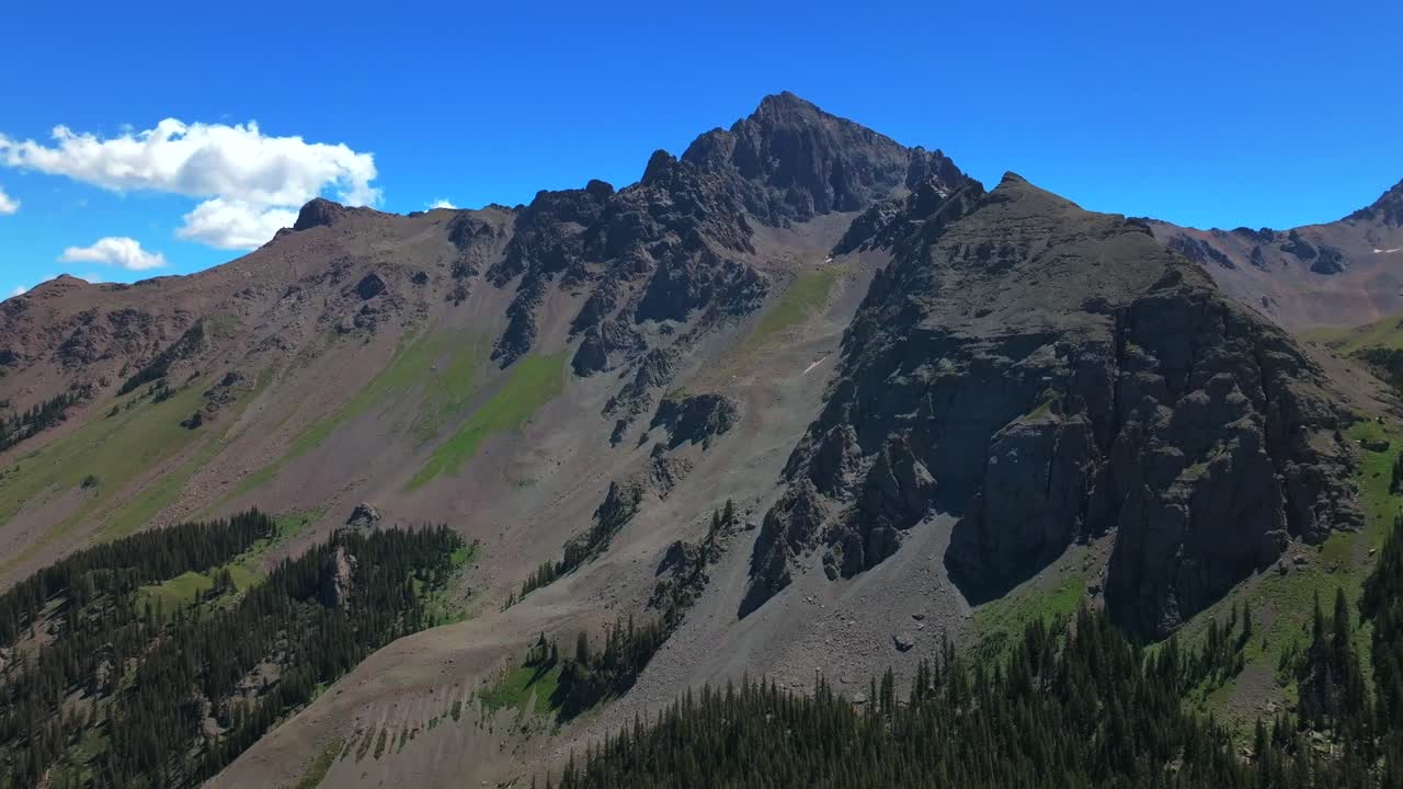 Mount Sneffels 14er peak Wilderness Blue Lakes Trailhead Last Dollar Road Ridgway Colorado aerial drone summer Uncompahgre National Forest Aspen trees blue skies clouds circle slowly left