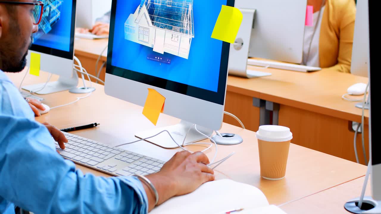 Executive using desktop pc at desk 4k