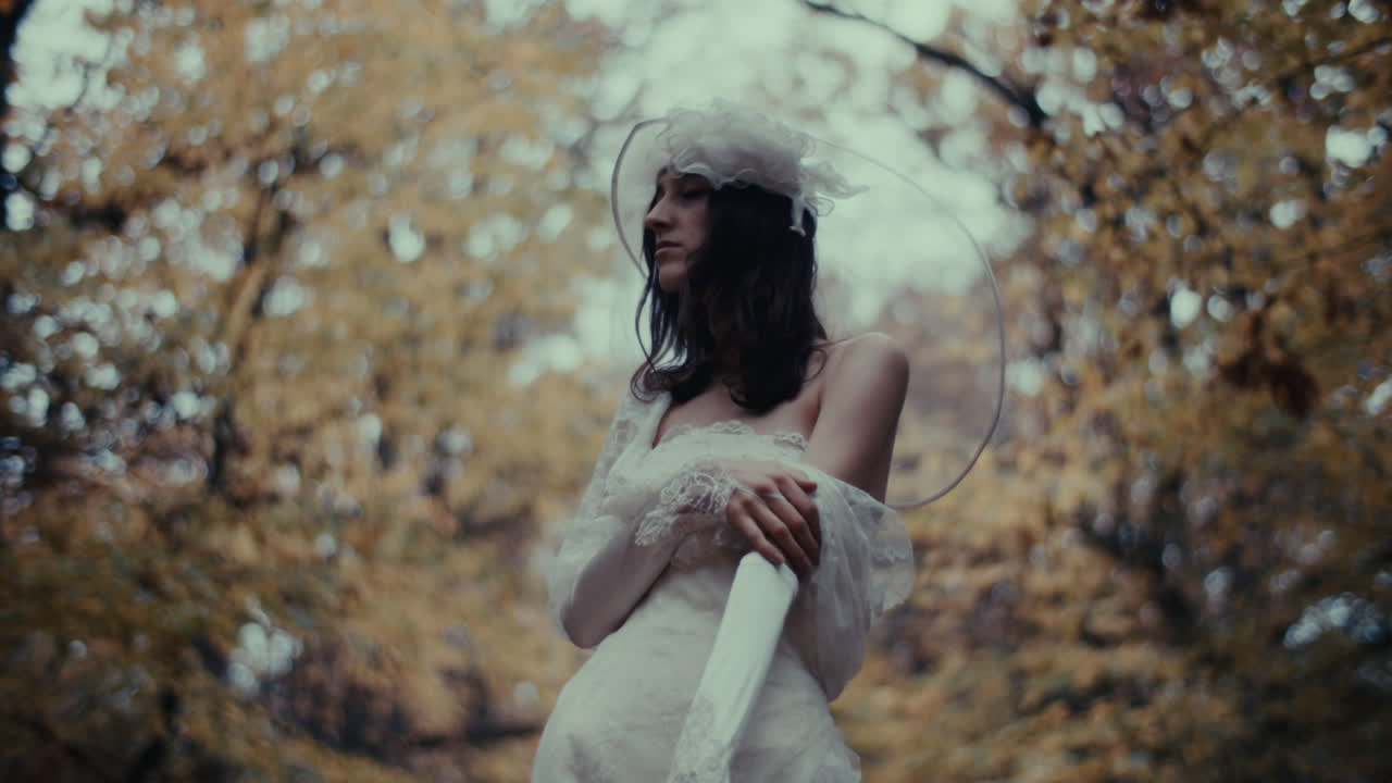 Woman in White Dress in Autumn Forest