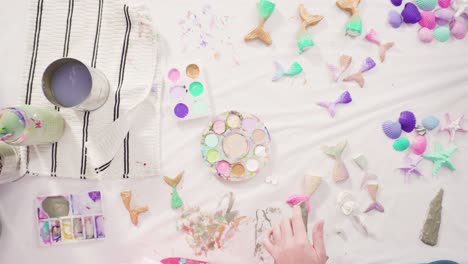 painting mermaid tails and seashells with acrylic paint