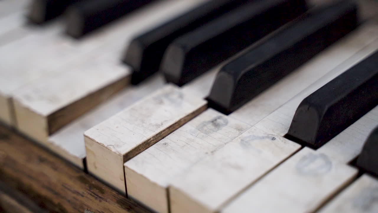 Closeup of Old Chipped Piano Keys with Faded Letters
