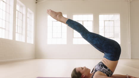beautiful-yoga-woman-exercising-healthy-lifestyle-practicing-boat-pose-enjoying-workout-in-studio-training-on-exercise-mat