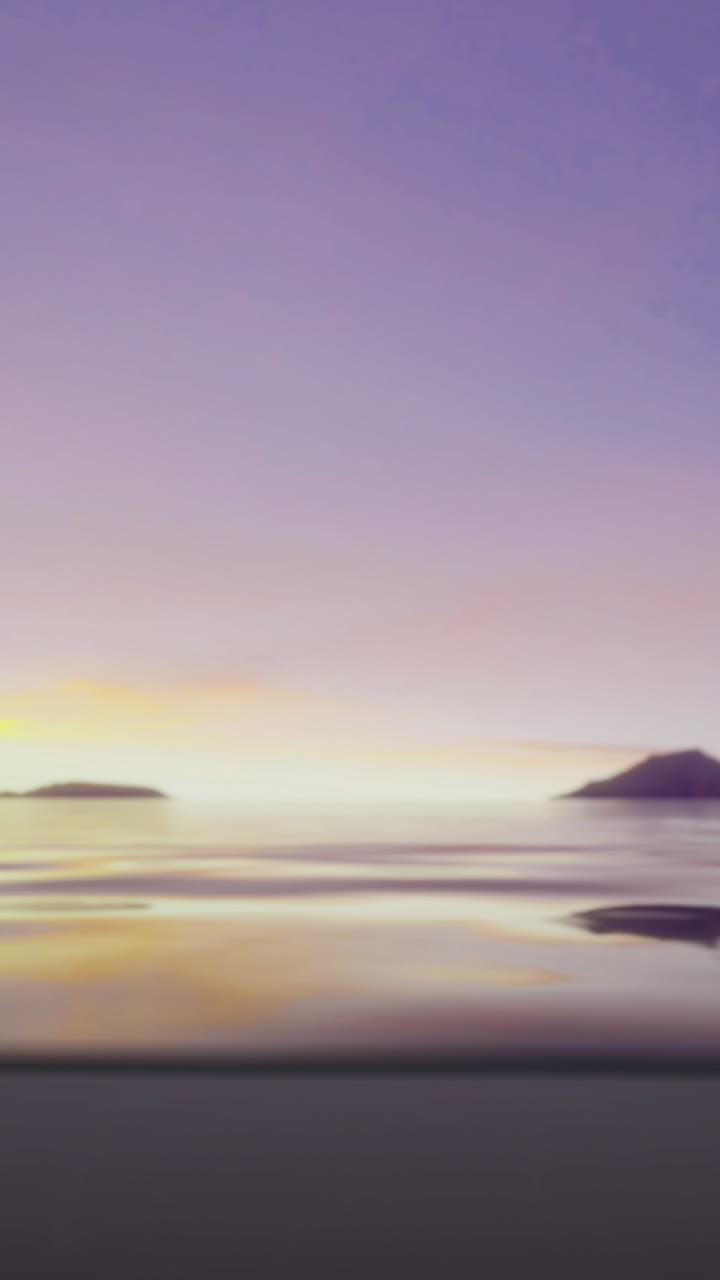 Tranquil sunset over calm waters with distant islands on the horizon