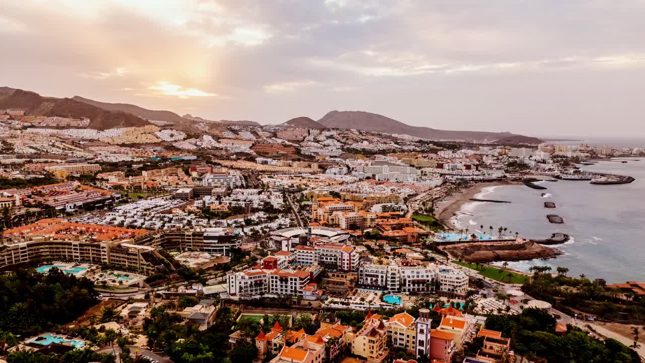 Dynamic hyperlapse of Costa Adeje, Tenerife, zooming in on Plaza del Duque mall