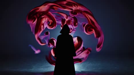 silhouette of a hooded figure surrounded by swirling, vibrant smoke