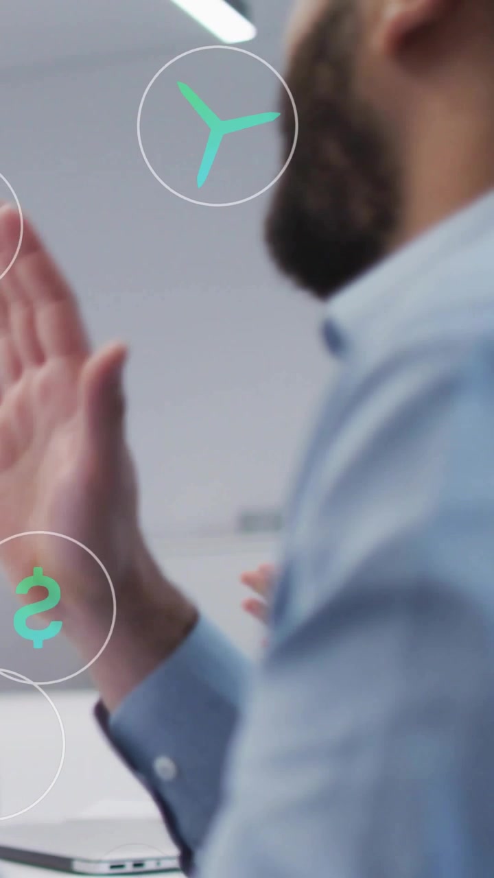Vertical video: Office man reaching phone, applauding presentation while green AR icons overlaying