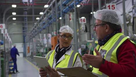 warehouse workers discussing together