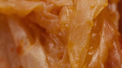 close-up of texture fermented spicy cabbage kimchi with in can. preservation of vegetables in glass jars. fermentation preserved kimchi cabbage with spices macro. asian cuisine.