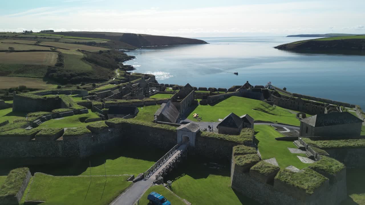 Liftoff over Charles Fort, a fortress in Kinsale, Ireland. Coastal panorama aerial.