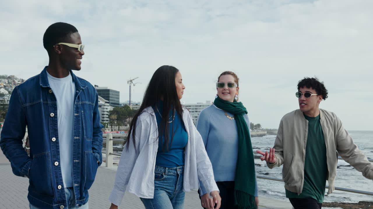 Group of Friends Walking by the Sea