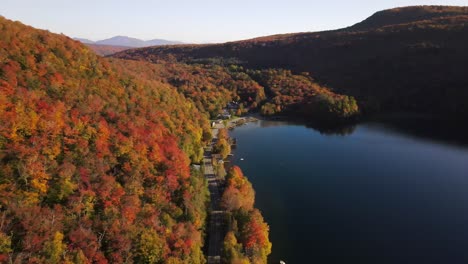 Beautiful-aerial-drone-footage-of-the-fall-leaves-on-and-around-Mount-Hor,-Mount-Pisgah,-and-Lake-Willoughby-during-peak-autumn-foliage-at-Willoughby-State-forest-in-Westmore,-Vermont