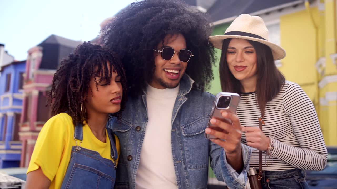 Friends taking photo on street