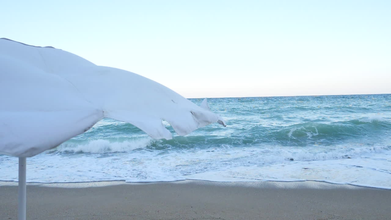 Beach umbrella in the wind