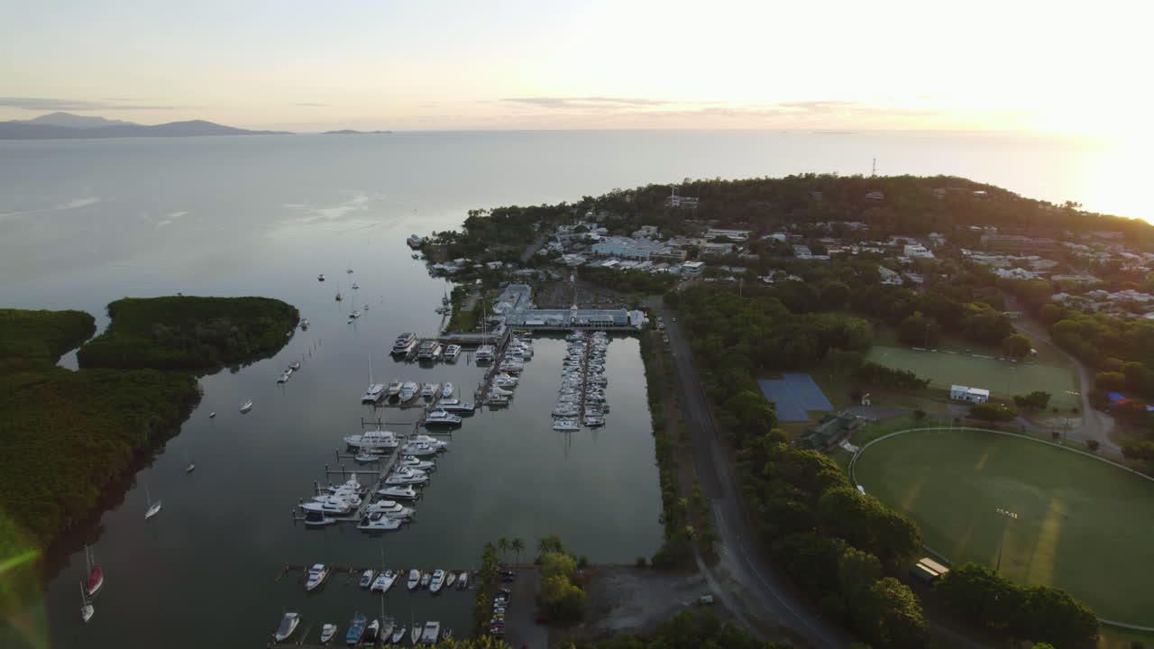 Aerial view away from the Port Douglas marina, colorful sunset in Australia