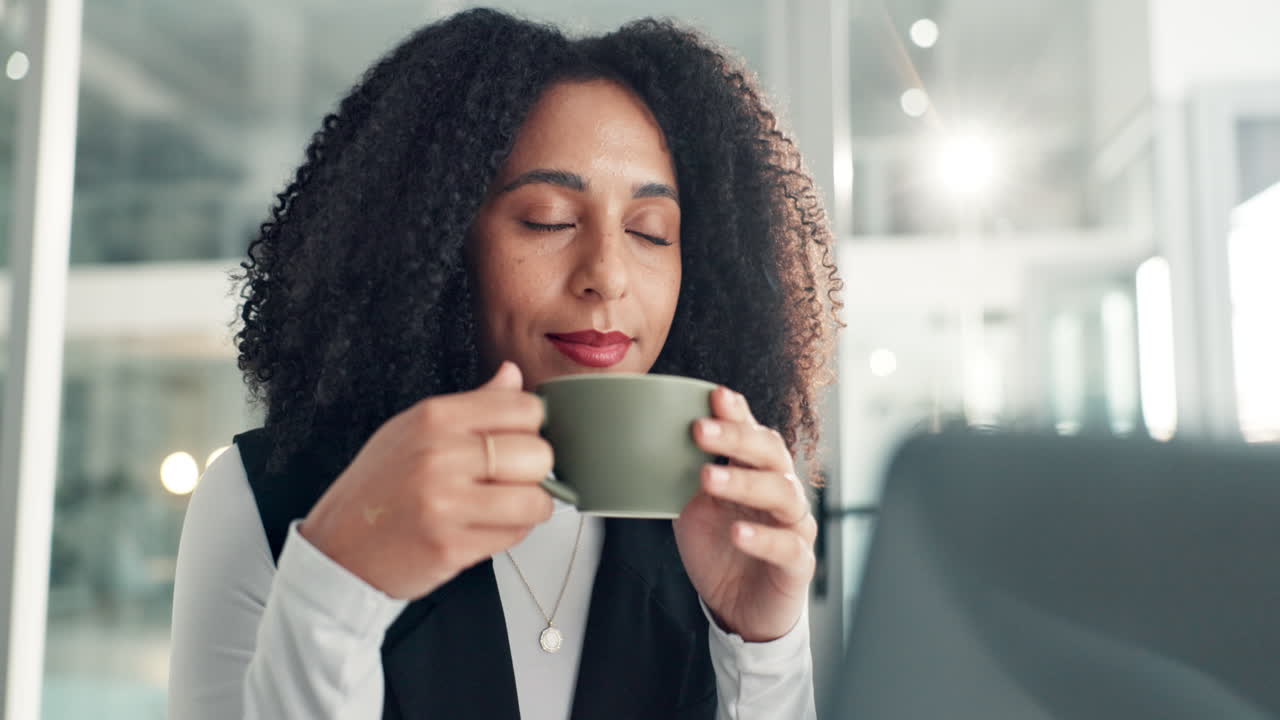 Woman Relaxing with Coffee in the Office