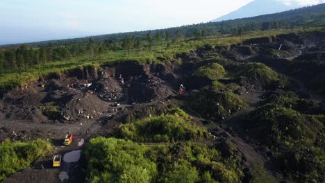 Large-destroyed-nature-after-excavator-digging-into-ground-for-sand-mine-in-sunlight