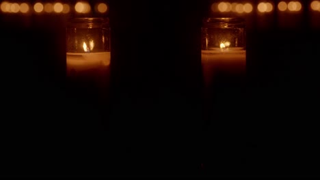 candles flickering with two people dancing in background