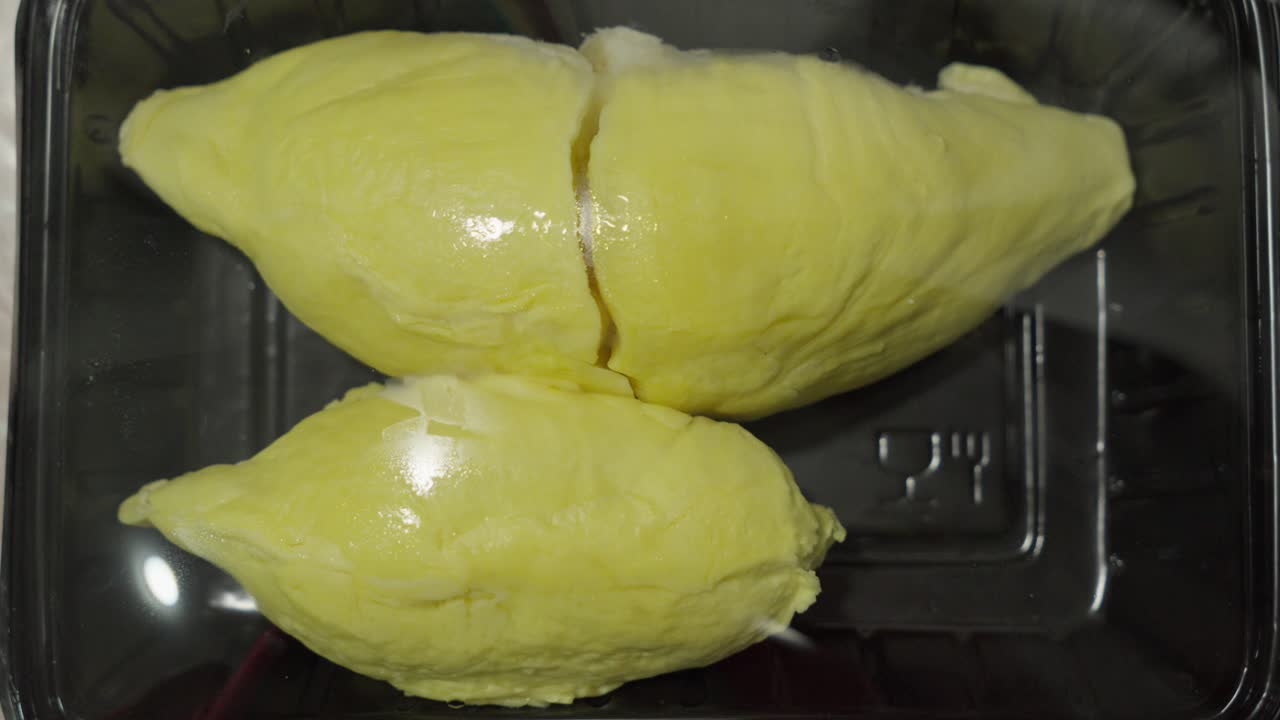 Durian, tropical fruit known for its distinctive smell and large size