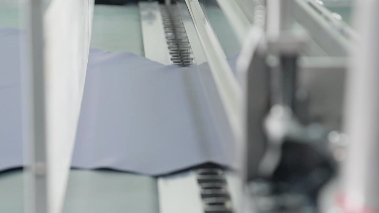 Leather Animal Hides Being Produced On A Automated Industrial Machinery In A Manufacturing Plant.