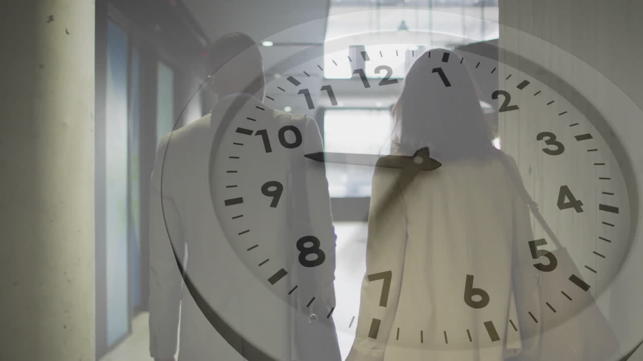 In office hallway, animation of clock face overlaying two people walking