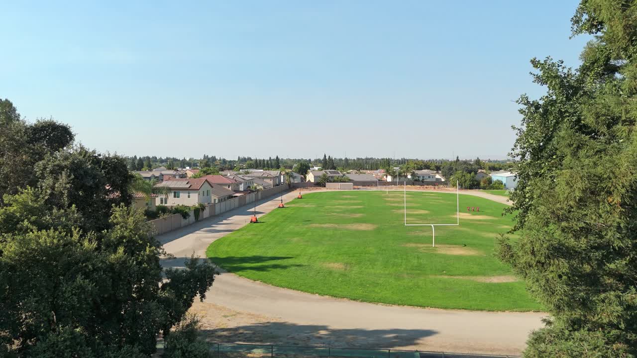 Ascending drone view of Sierra View neighborhood in Oakdale, California, with suburban homes, quiet streets, and Central Valley scenery, ideal for residential and community stock footage