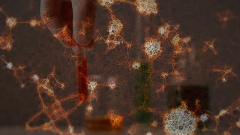 animación de estructuras moleculares en primer plano de una mano que sostiene un tubo de ensayo lleno de productos químicos
